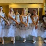 ballet dancers wearing white dresses
